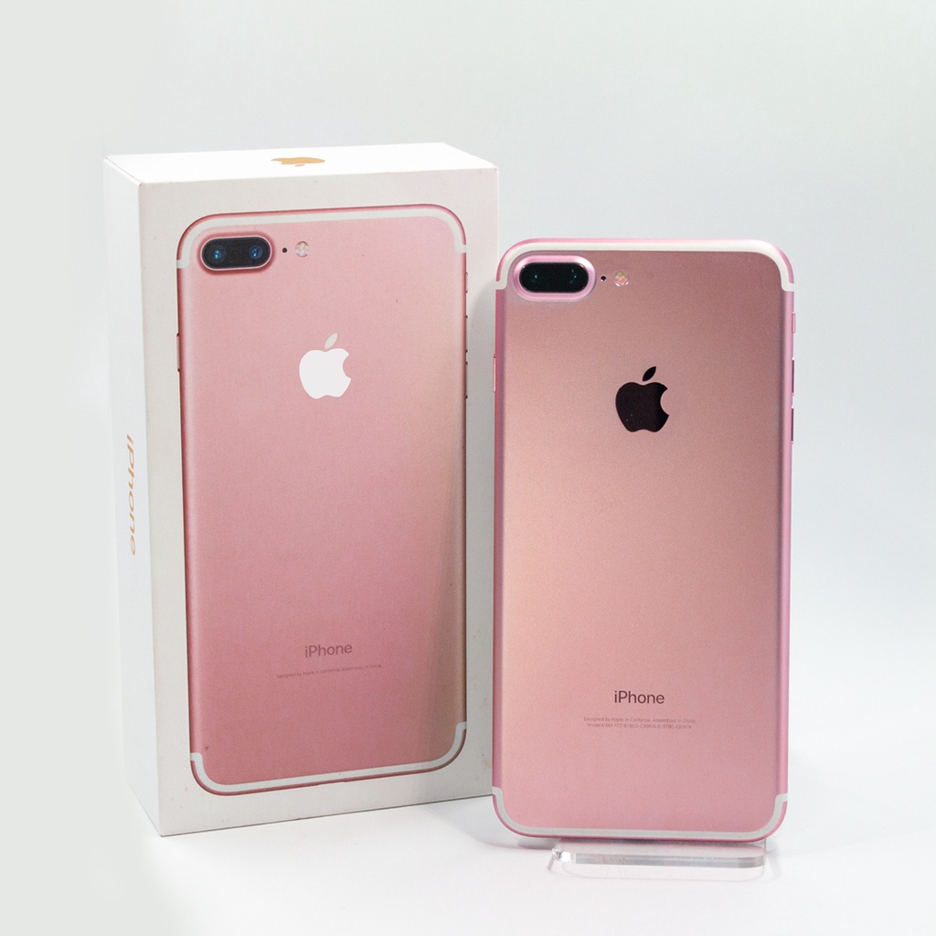 Celular iPhone 7 Plus na cor oyro rosê ao lado de sua embalagem