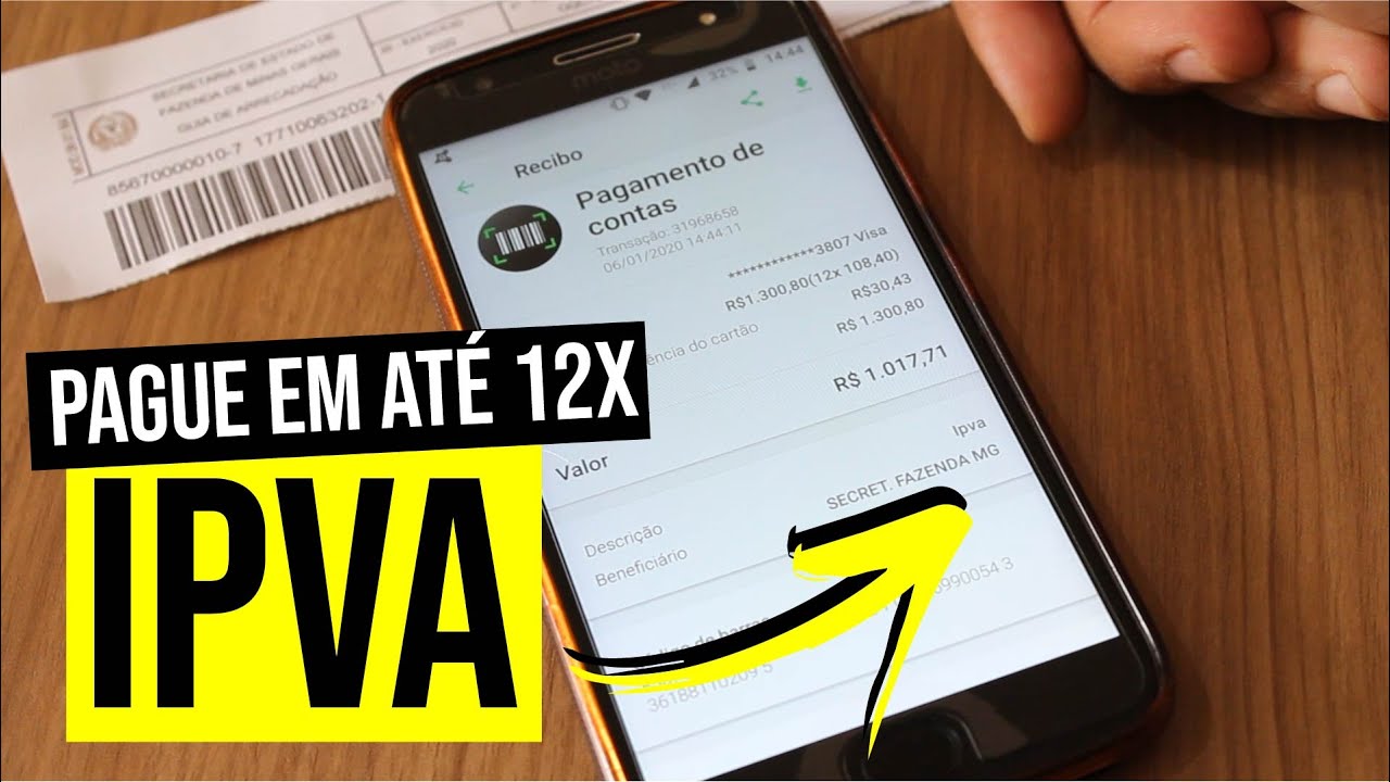 celular na mesa, com recibo de IPVA aberto na tela